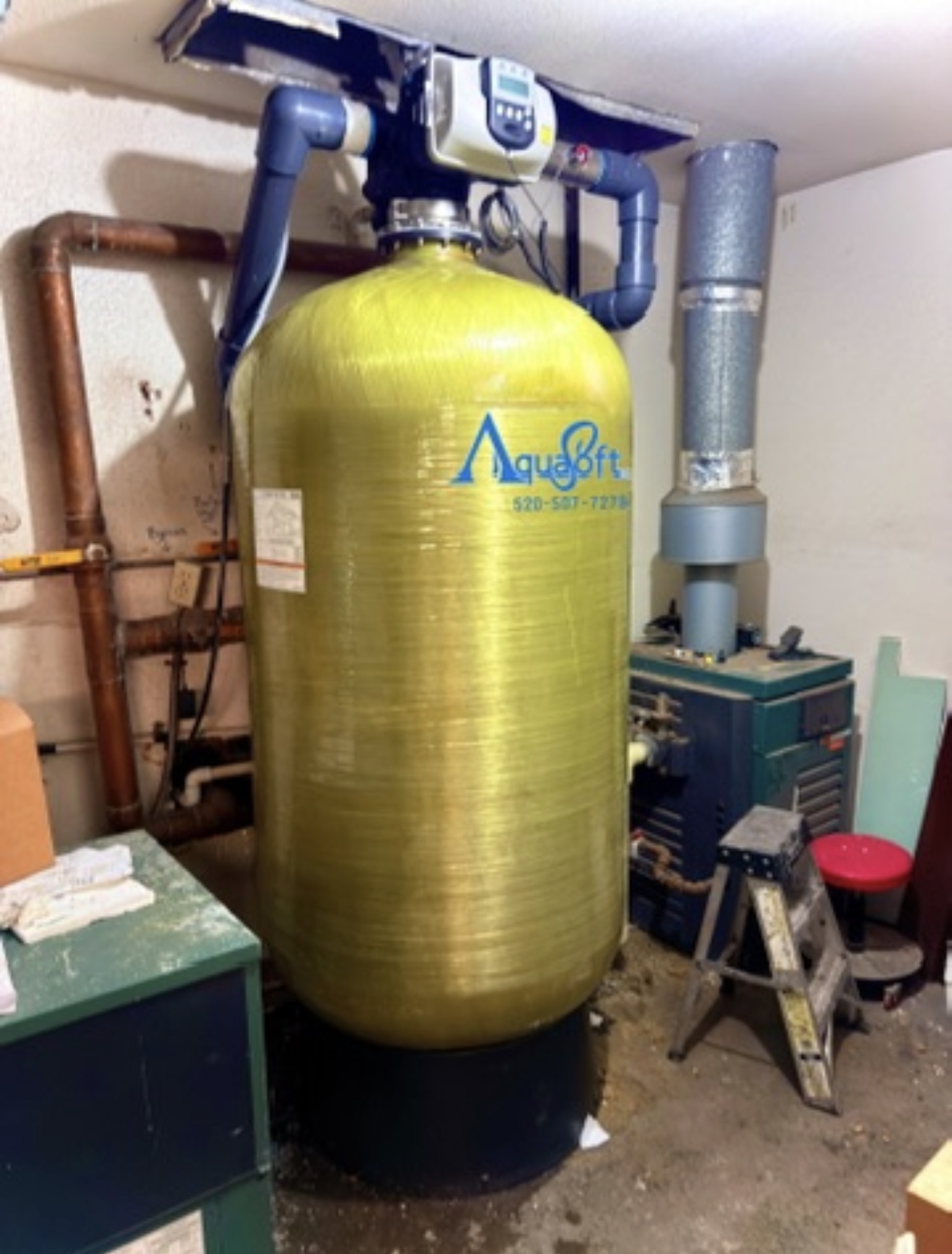 Large Aqua Soft commercial water-treatment tank installed in a mechanical room